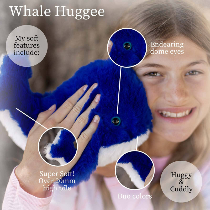Young girl holding blue whale plush toy with product feature callouts