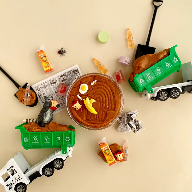 EarthGrown KidDoughs PK Garbage playset with toy trucks, recycling bins, and brown play dough