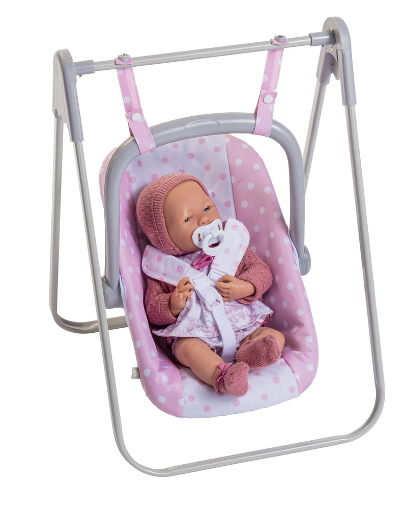 Berenguer Boutique baby doll in pink polka-dot carrier seat on gray metal swing stand