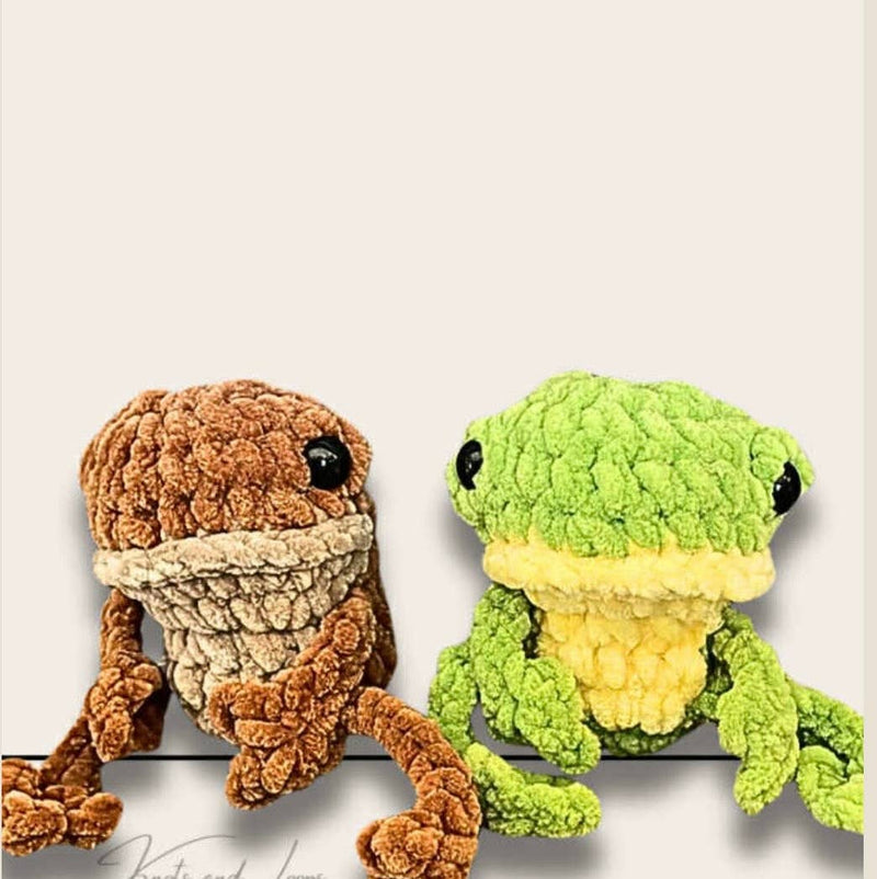 Two plush textured frogs - brown and green - sitting on white background