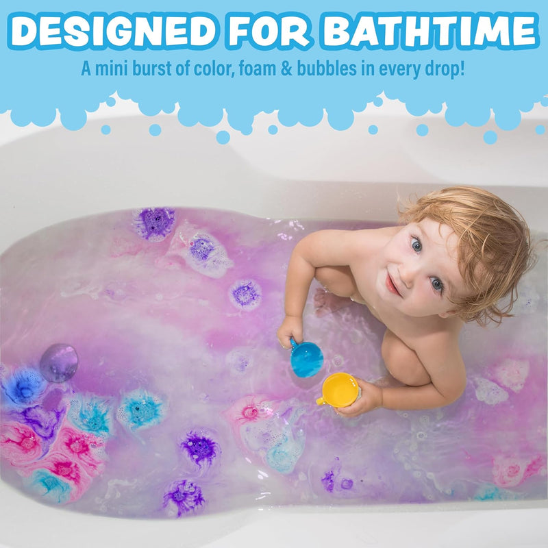 Child playing with colorful mini bath bombs in purple tinted bath water