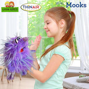 Young girl playing with purple Mooks puppet from Living Puppets brand