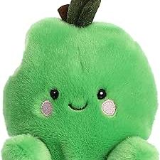 Green apple-shaped plush toy with cute face, leaf on top, and small arms