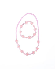 Pink crystal flower beaded necklace and bracelet jewelry set on white background