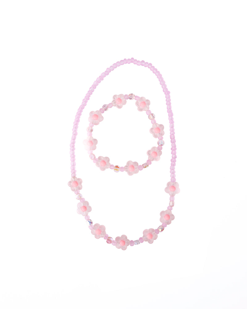 Pink crystal flower beaded necklace and bracelet jewelry set on white background