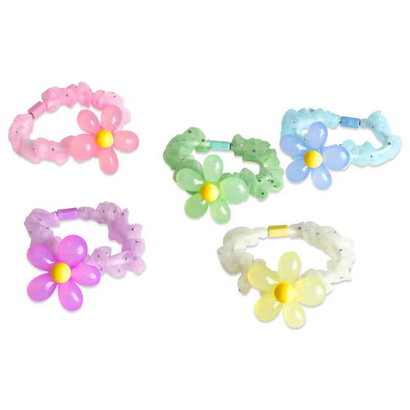 Five colorful flower-shaped hair ties in pink, purple, green, blue, and yellow on white background