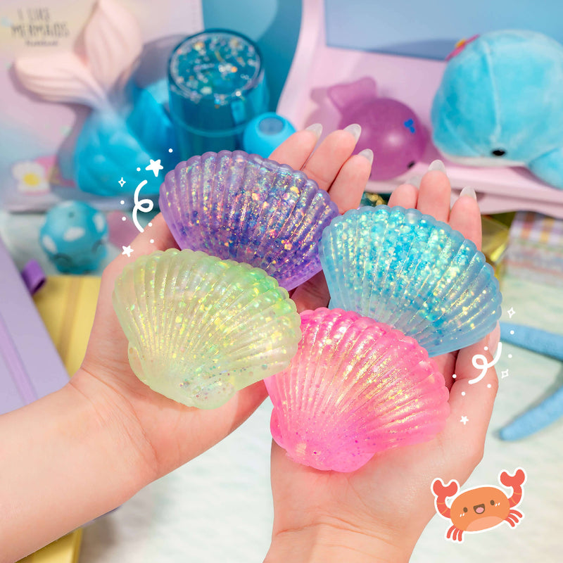 Four glittery squishy seashells in purple, blue, green, and pink held in hands