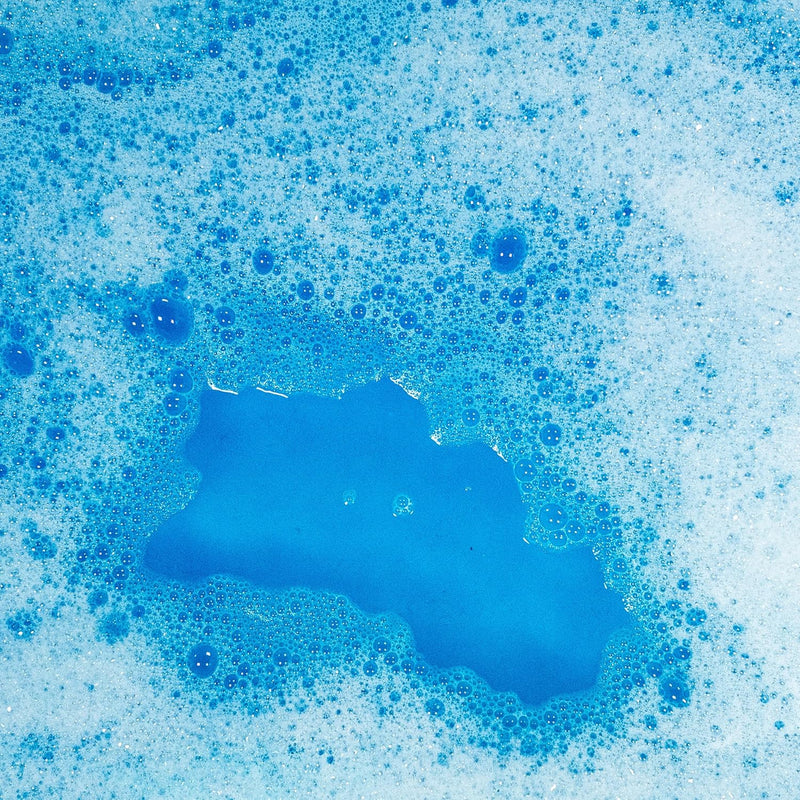 Blue bubble bath foam with bubbles showing magical fizzy texture