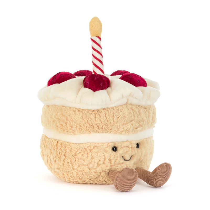 Jellycat Amuseables Birthday Cake plush toy with smiling face, striped candle, and red berries