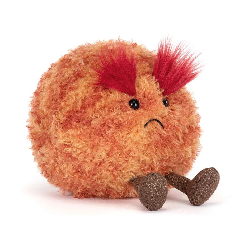 Orange furry plush toy with red spiky hair and sad expression representing Planet Mars