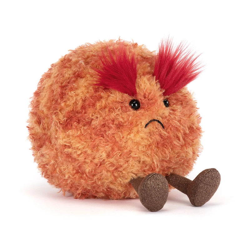 Orange furry plush toy with red spiky hair and sad expression representing Planet Mars