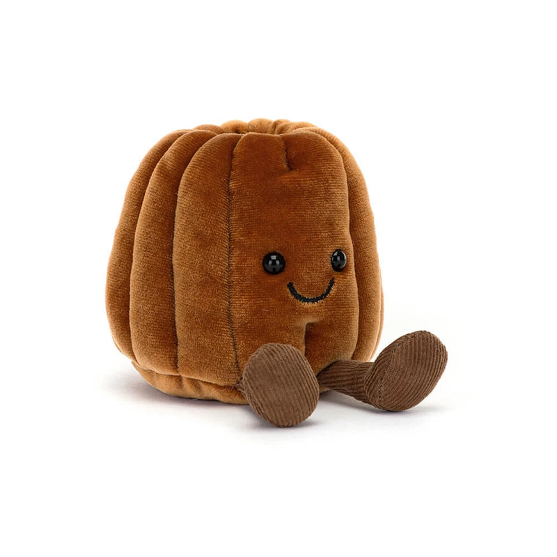 Brown corduroy plush toy shaped like a canelé pastry with cute face and legs