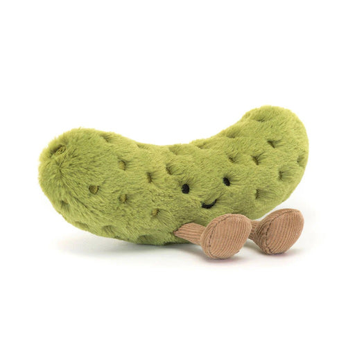 Green plush pickle toy with embroidered seeds and corduroy feet on white background