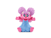Tonie Abby Cadabby figurine with purple pigtails, pink fur, blue body in sitting pose