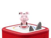 Pink pig Tonie figure on red Toniebox speaker with white background
