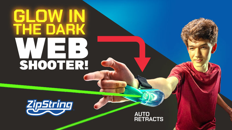 ZipString glow in the dark web shooter worn on wrist demonstrating auto-retract feature