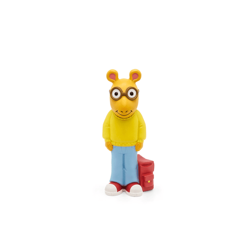 Arthur Tonie figure with yellow sweater, blue jeans, glasses and red backpack on white background