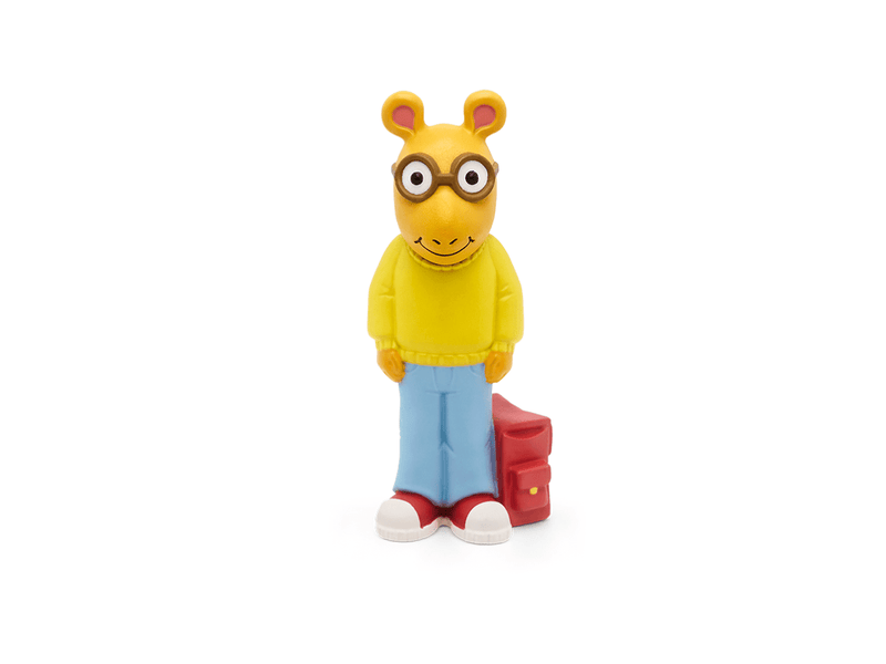 Arthur Tonie figurine with yellow sweater, blue jeans, glasses and backpack on white background
