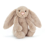 Beige plush bunny with long ears and pink nose on white background