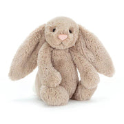 Beige plush bunny rabbit stuffed animal with long ears on white background