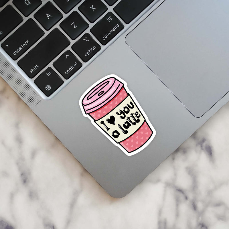 Pink coffee cup vinyl sticker with 'I Love You A Latte' text on laptop