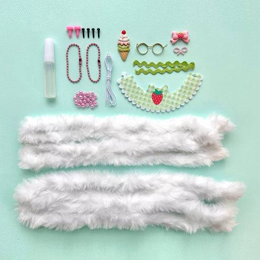 DIY craft kit components including white fur, beads, accessories for making bunny dolls