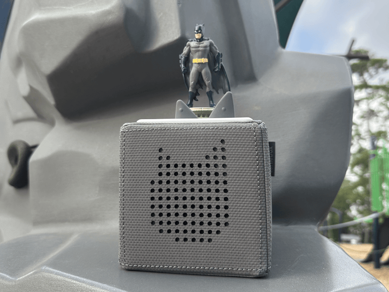 Gray Toniebox with Batman figure on top in outdoor setting