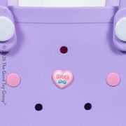 Close up of purple children's beach tote bag from Hot Focus.  Comes with heart charm and small pink purse on a white background.