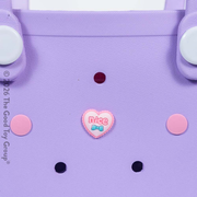 Close up of purple children's beach tote bag from Hot Focus.  Comes with heart charm and small pink purse on a white background.