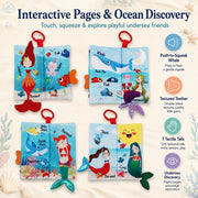 Bebe Mondo Mermaid Tails Crinkle Cloth Book shown open to its colorful undersea activity pages and sensory features.