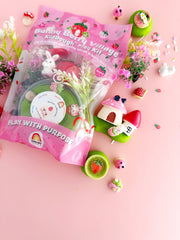 Bunny Berry Village playdough kit with strawberry theme accessories on pink background