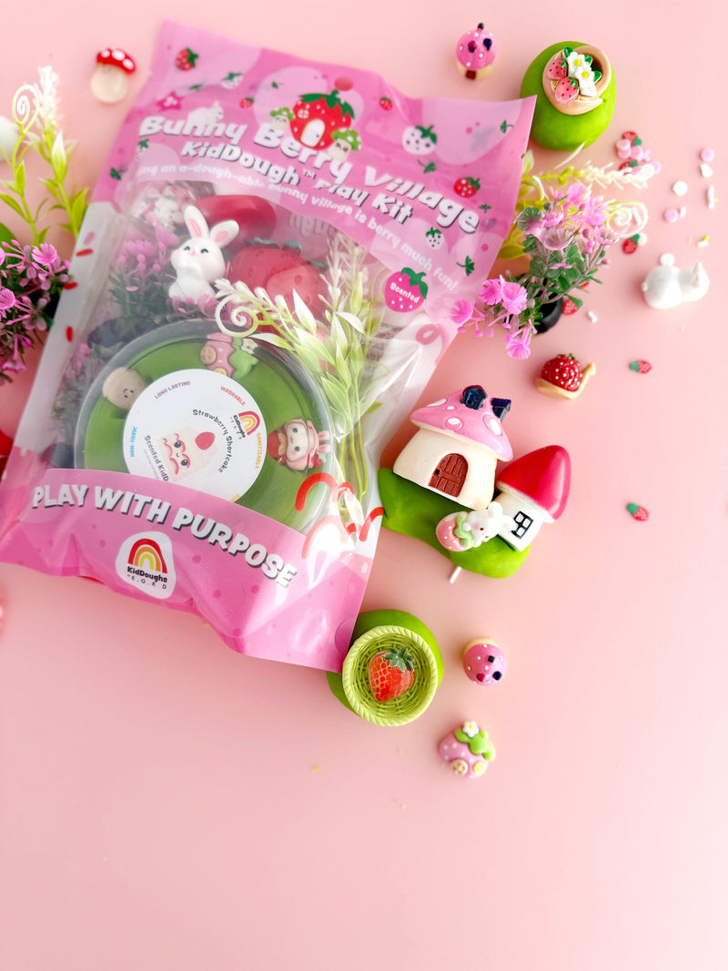 Bunny Berry Village playdough kit with strawberry theme accessories on pink background