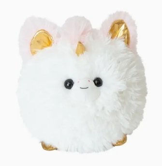 White fluffy unicorn plush toy with golden horn and ears on plain background