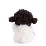 Black and white crocheted sheep plush toy on white background