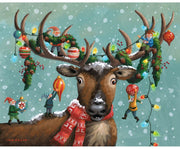 A festive illustrated scene featuring a brown reindeer with large antlers, wearing a red patterned scarf and surrounded by holiday decorations, colorful lights, ornaments, and small elf figures against a snowy mint-green background.