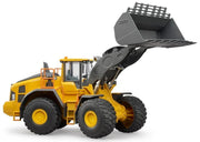 A yellow and black toy or model wheel loader with a large gray front bucket, shown on a clean white background.