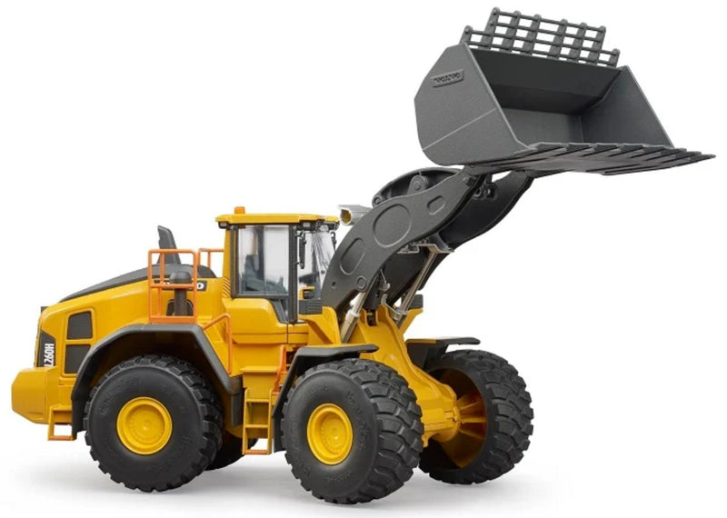 A yellow and black toy or model wheel loader with a large gray front bucket, shown on a clean white background.