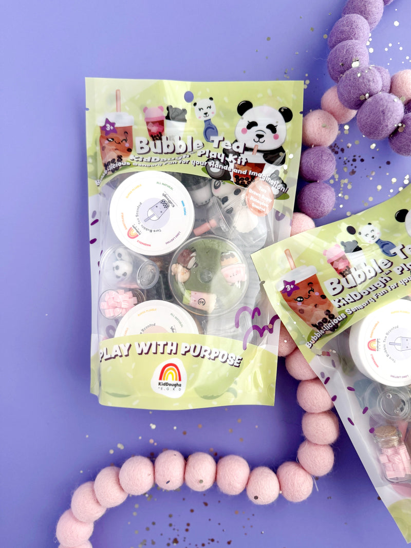 Bubble Tea playdough kit with containers and colorful felt balls on purple background