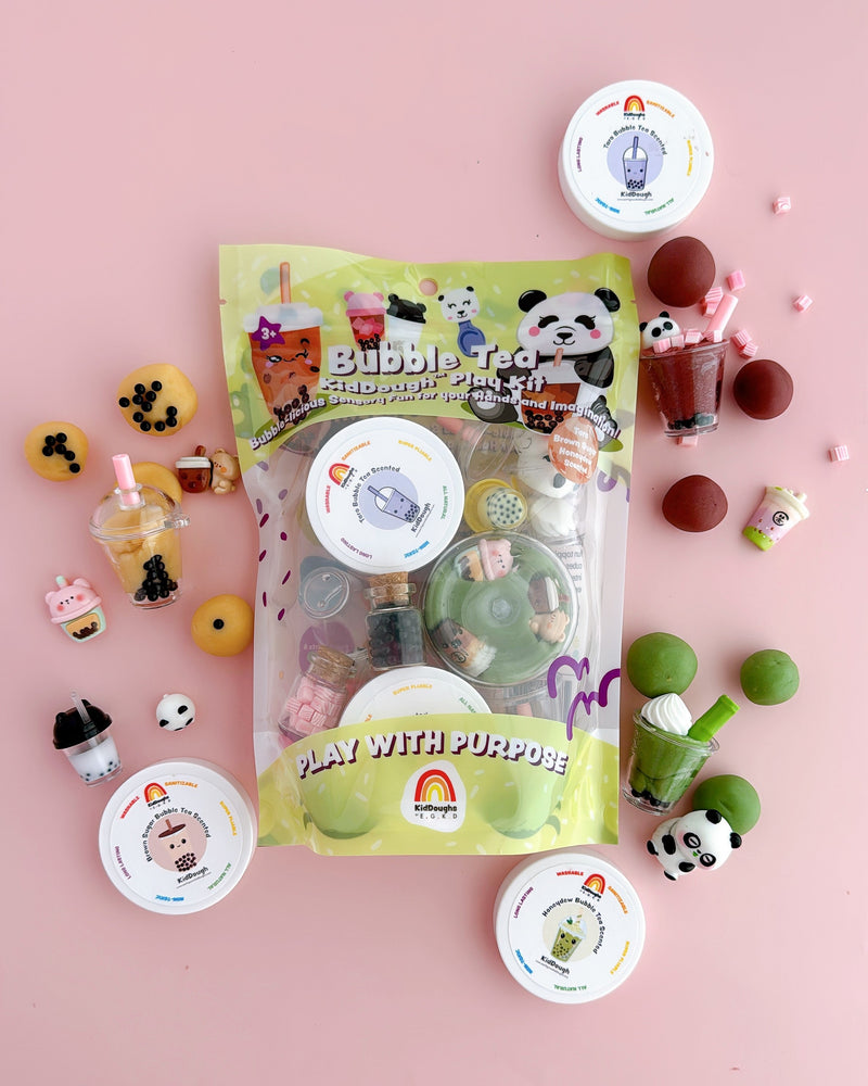 Bubble Tea play kit with playdough containers and bubble tea themed accessories on pink background