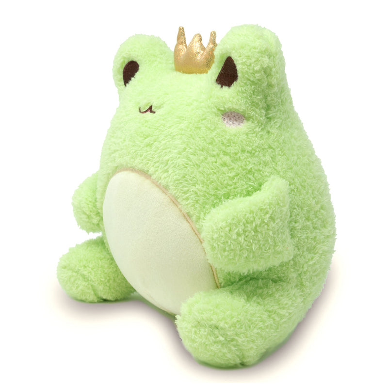 Green plush frog toy with golden crown sitting upright on white background