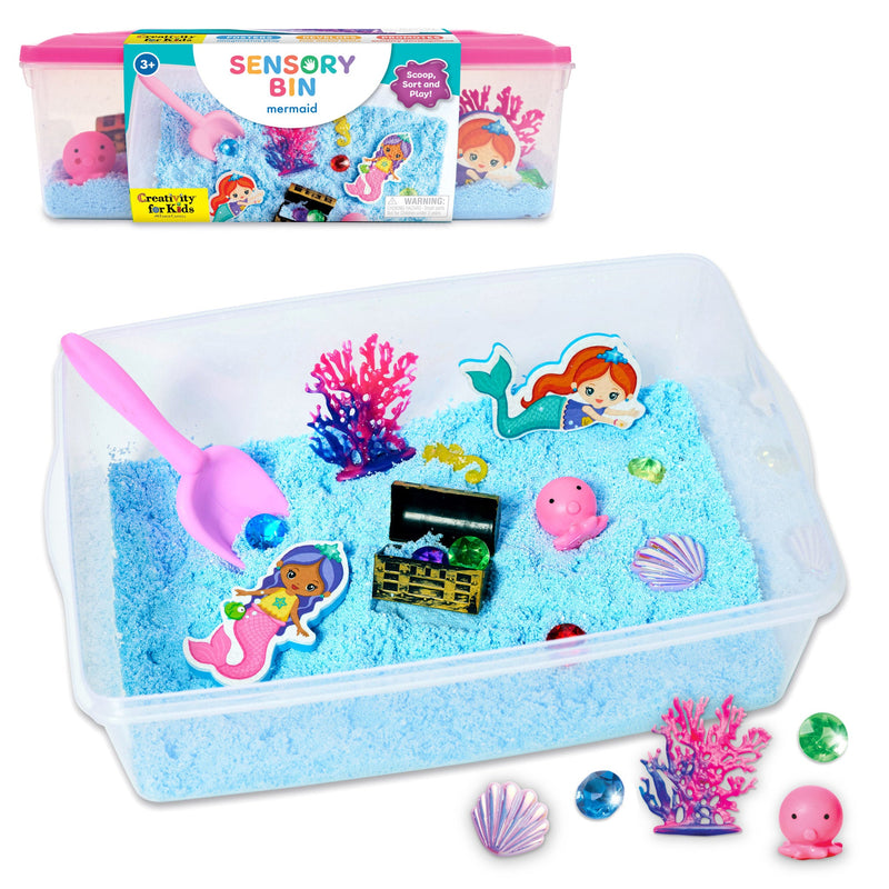 Creativity for Kids Mermaid Sensory Bin with blue kinetic sand, mermaid figurines, treasure chest, and accessories