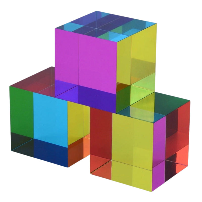 Three stacked translucent acrylic cubes with mirrored, rainbow-colored reflective surfaces on a plain white background.
