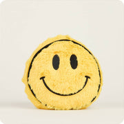 Yellow fuzzy smiley face plush toy with black embroidered features on white background