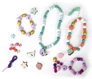 Mermaid themed wooden beads and charms with bracelets on white background