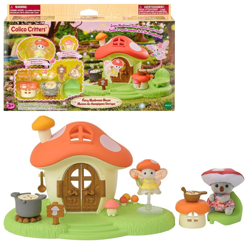 Calico Critters Furry Mushroom House toy set shown with its retail box on a white background. The set includes a small mushroom-shaped house with an orange roof, green grass base, mushroom characters, a pot, and accessories.