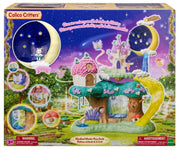 Calico Critters Magic Forest Fairy Castle toy set in its original retail packaging, featuring a colorful fairy treehouse, moon-shaped night sky, and castle on the box front.