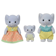 Calico Critters Elephant Family Trio plush figures — mother in pink floral dress, baby in cream overalls, and father in teal and yellow outfit.