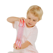 Child holding a the Candyland Calm Down bottols on a white background.