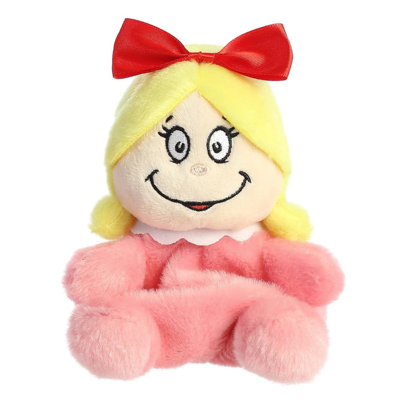 Cindy Lou Hoo Palm Pal Plush toy with blonde hair, red bow, and pink outfit on a white background.