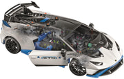 A white, black, and blue toy sports car model shown from a high angle, with its doors open to reveal a detailed internal mechanical structure and driver's seat. The side door features the text 'STM'.